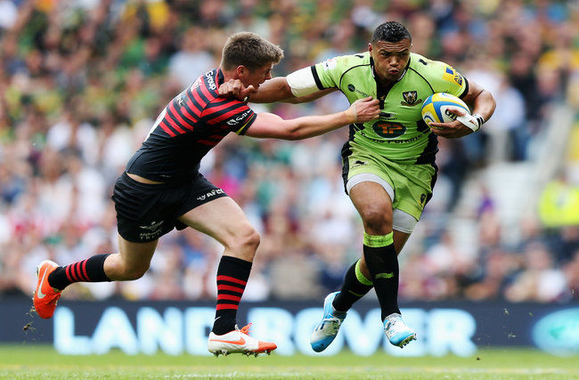 Luther Burrell tries to fend off Owen Farrell in the first half
