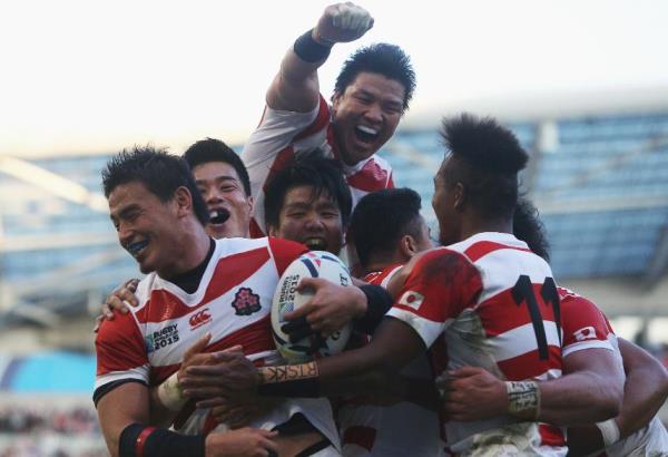 Japanese players celebrate after beating the Springboks