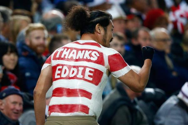 A Japanese supporter with a "Thanks Eddie" message painted on his back.