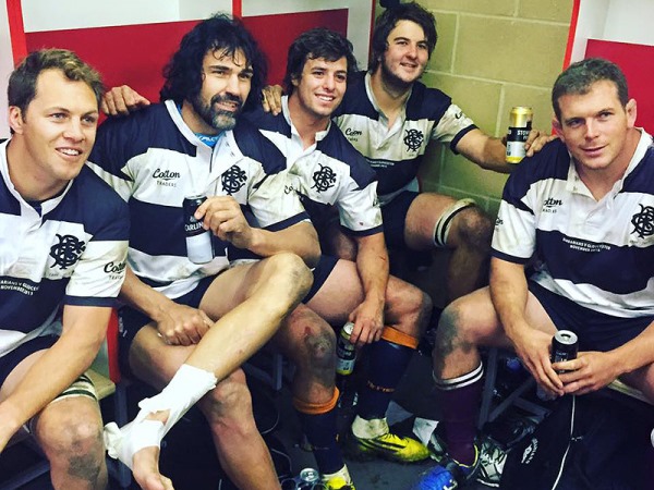 Barbarians team members celebrate in the changeroom after the Gloucester game
